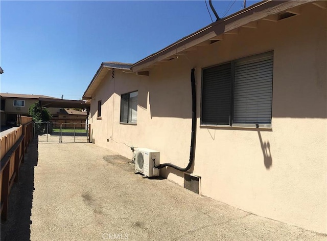 view of side of property featuring ac unit