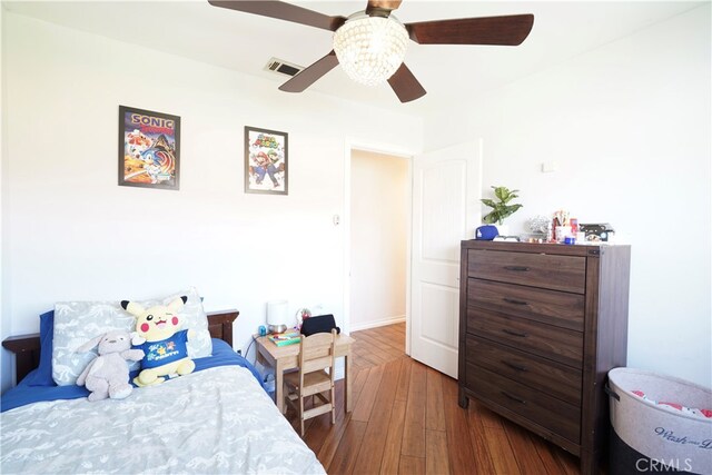 2425 N Fillmore Ave, Rialto, CA 92377 - bedroom featuring ceiling fan, hardwood / wood-style floors, and visible vents