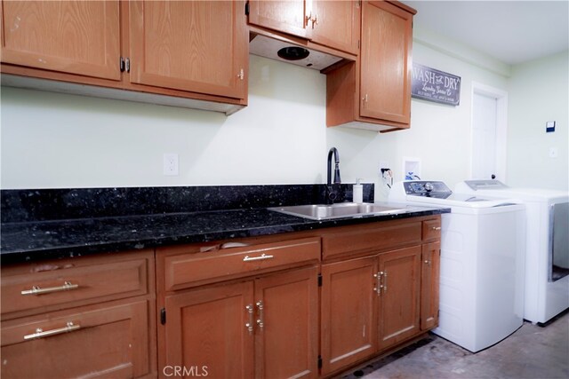2425 N Fillmore Ave, Rialto, CA 92377 - clothes washing area with cabinet space, washing machine and dryer, and a sink
