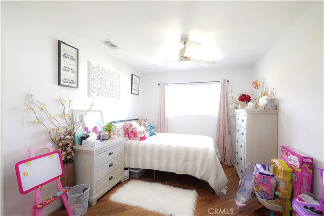 2425 N Fillmore Ave, Rialto, CA 92377 - bedroom with a ceiling fan, light wood-style flooring, and visible vents