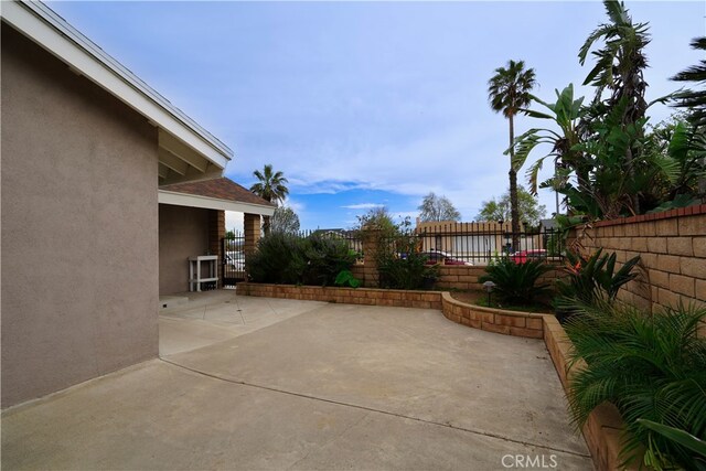 2425 N Fillmore Ave, Rialto, CA 92377 - view of patio with a fenced backyard