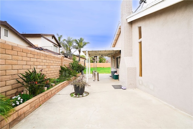 2425 N Fillmore Ave, Rialto, CA 92377 - view of patio / terrace with a pergola and a fenced backyard