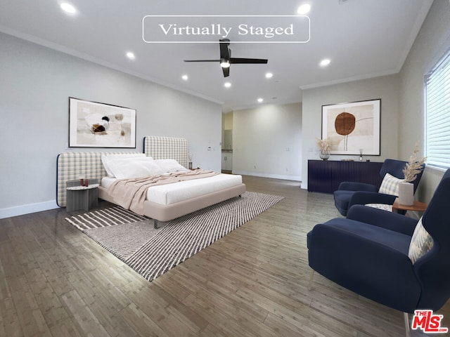 bedroom featuring hardwood / wood-style flooring, ceiling fan, and ornamental molding