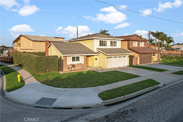 view of front of home featuring a front yard and a garage