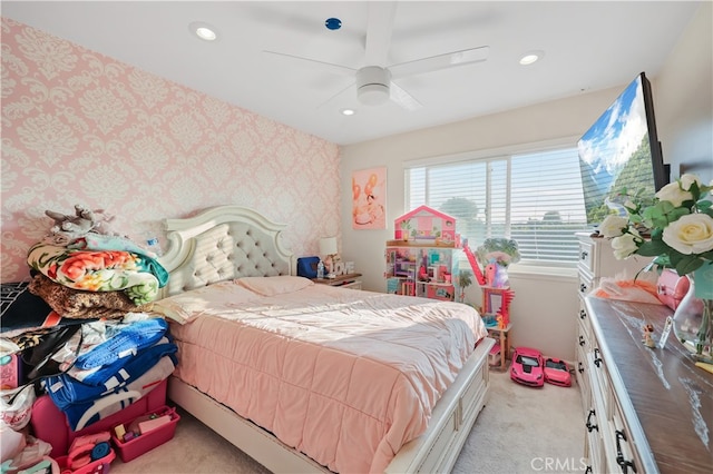 bedroom featuring ceiling fan and light colored carpet