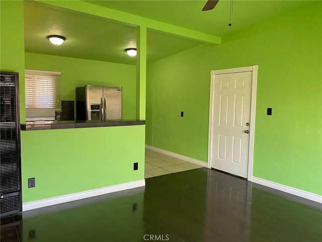 kitchen with stainless steel refrigerator with ice dispenser, light wood-type flooring, and ceiling fan