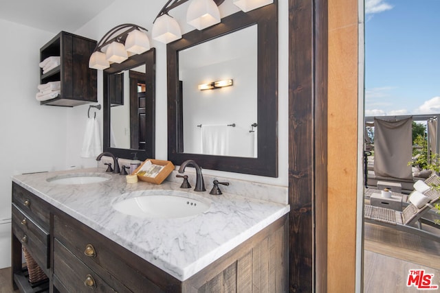 bathroom with vanity and hardwood / wood-style floors