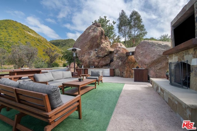 view of patio / terrace with a mountain view