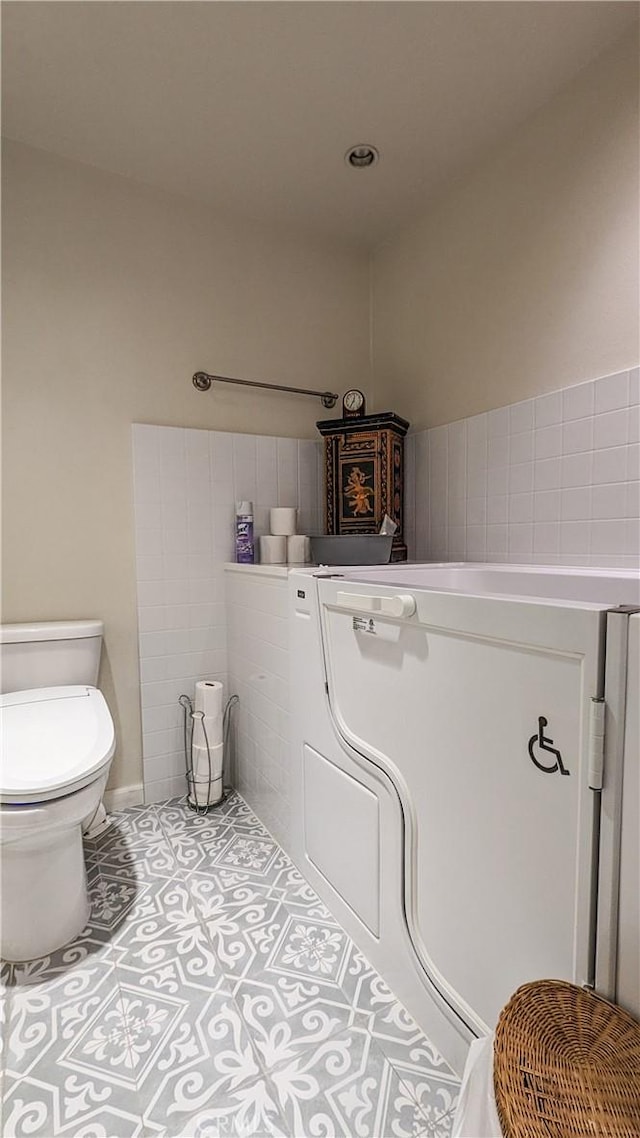 bathroom featuring tile patterned floors and toilet