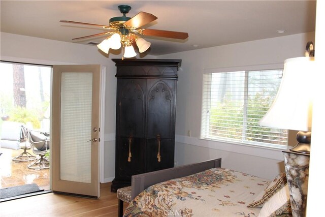 bedroom with access to outside, ceiling fan, and light hardwood / wood-style flooring