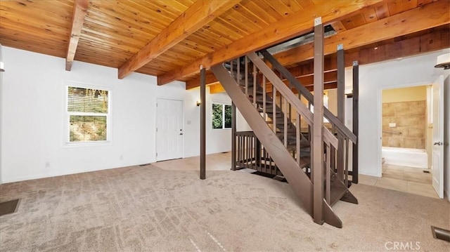 interior space featuring light colored carpet and wooden ceiling