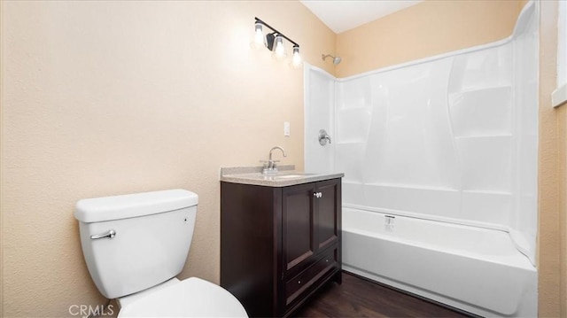 full bathroom featuring shower / tub combination, hardwood / wood-style floors, vanity, and toilet