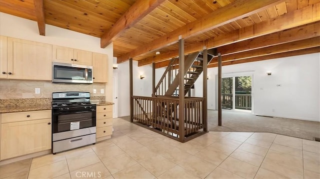 kitchen with light carpet, appliances with stainless steel finishes, light stone counters, wood ceiling, and beam ceiling