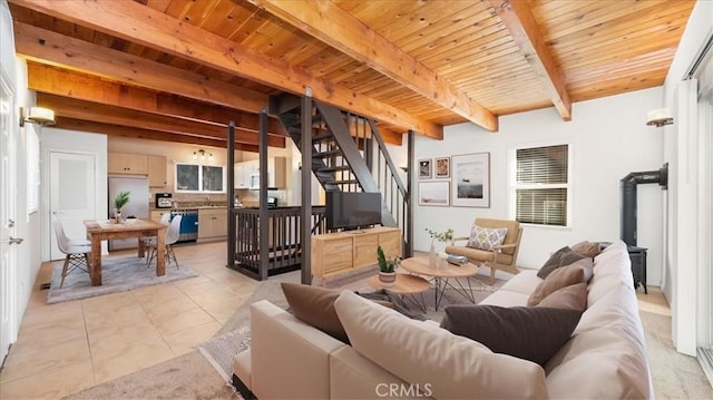 living room featuring beam ceiling, wooden ceiling, and light tile patterned flooring