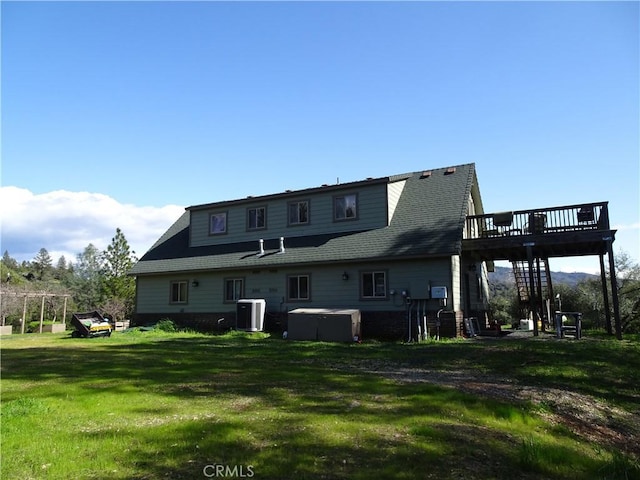 rear view of property with a deck, a pergola, cooling unit, and a yard