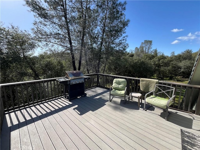 wooden terrace with area for grilling