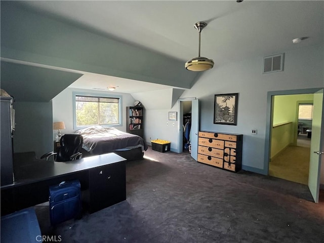 carpeted bedroom with vaulted ceiling