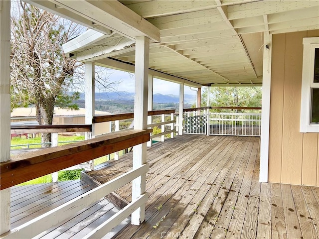 wooden terrace featuring a mountain view