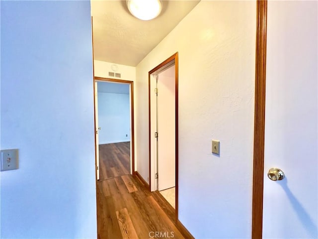 hallway featuring hardwood / wood-style floors