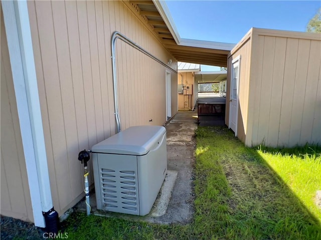 exterior space featuring a hot tub