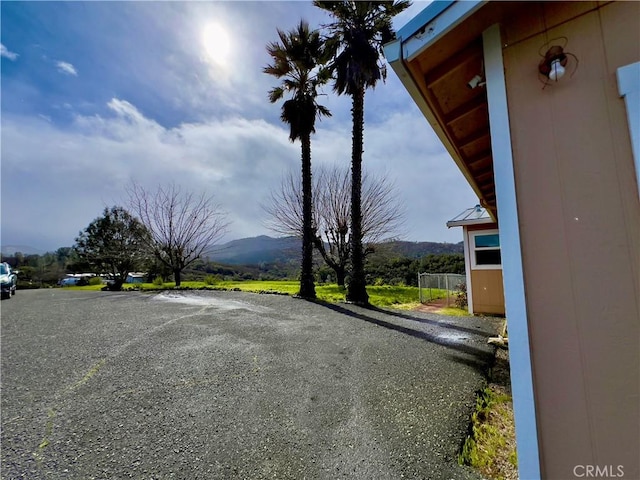 view of vehicle parking with a mountain view