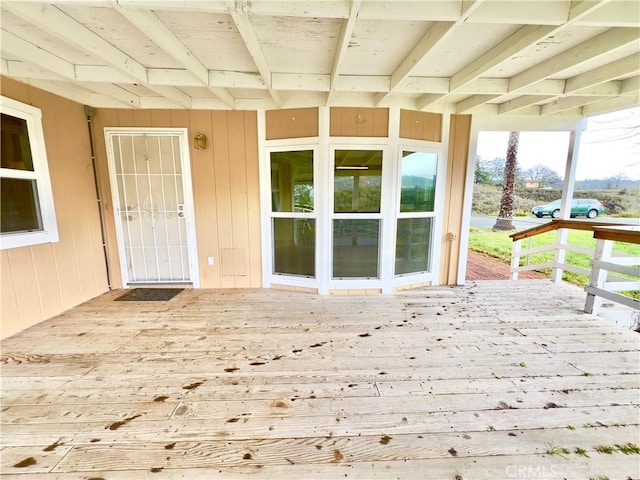 property entrance with a deck