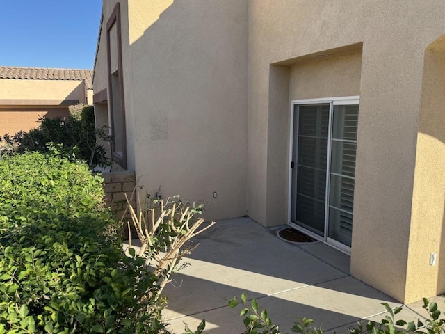 property entrance with a patio