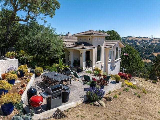 back of property with a patio area