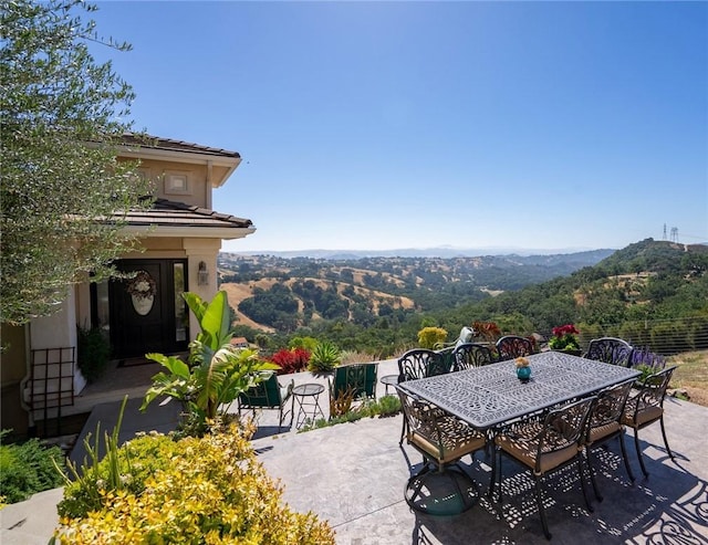 view of patio / terrace with a mountain view