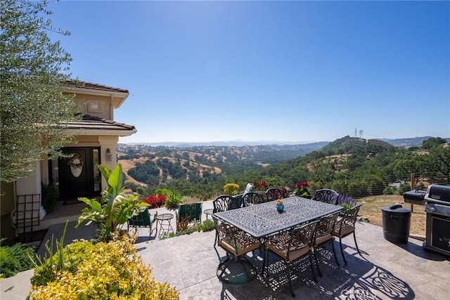 view of patio / terrace featuring a mountain view