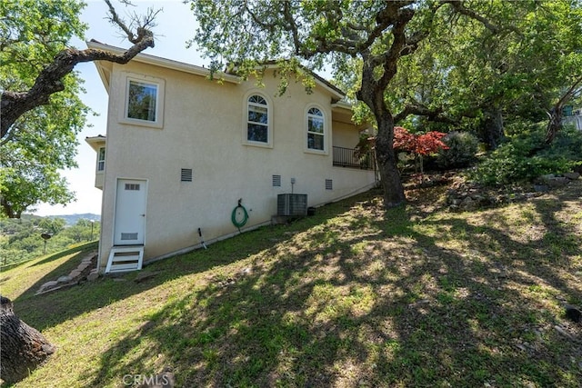 14600 El Monte Rd, Atascadero, CA 93422 - rear view of house featuring a yard, stucco siding, and central AC unit