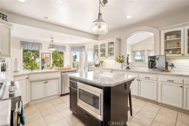 14600 El Monte Rd, Atascadero, CA 93422 - kitchen with stainless steel appliances, a sink, decorative backsplash, light tile patterned floors, and recessed lighting