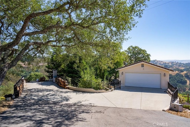 14600 El Monte Rd, Atascadero, CA 93422 - view of front of home featuring stucco siding, a garage, and driveway