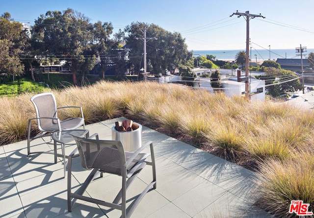 view of patio / terrace with a water view