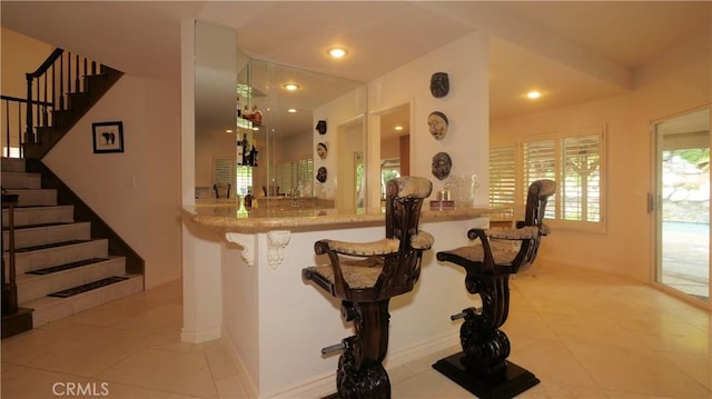 interior space featuring light tile patterned floors