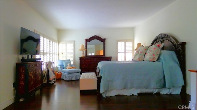 bedroom featuring dark wood-type flooring