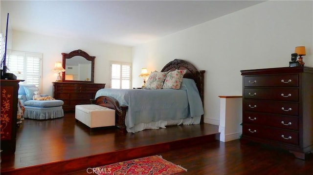 bedroom featuring dark wood-type flooring