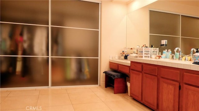 bathroom with tile patterned floors and vanity