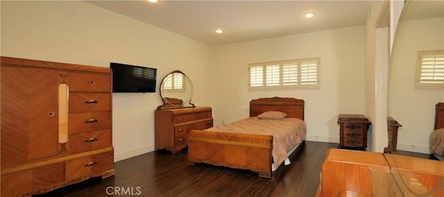 bedroom featuring dark hardwood / wood-style flooring