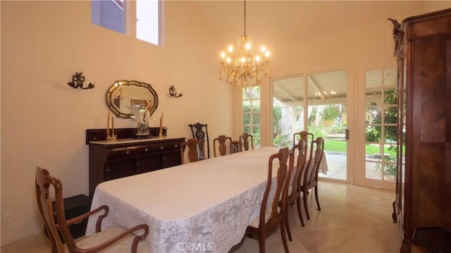 tiled dining room featuring a notable chandelier