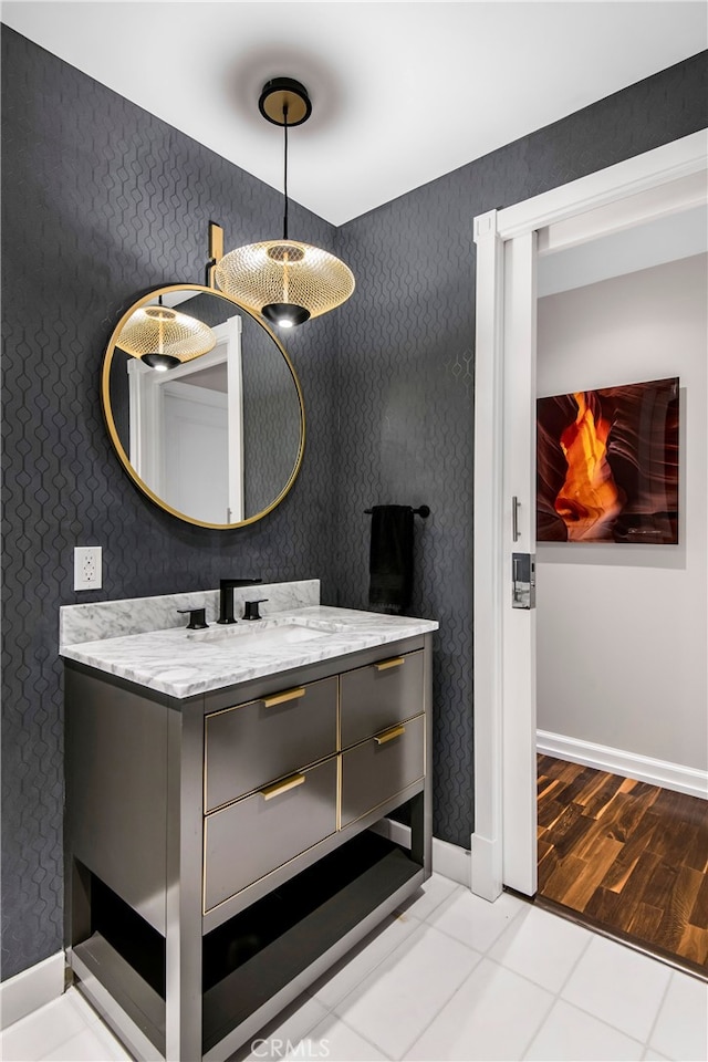 bathroom with tile patterned flooring and vanity