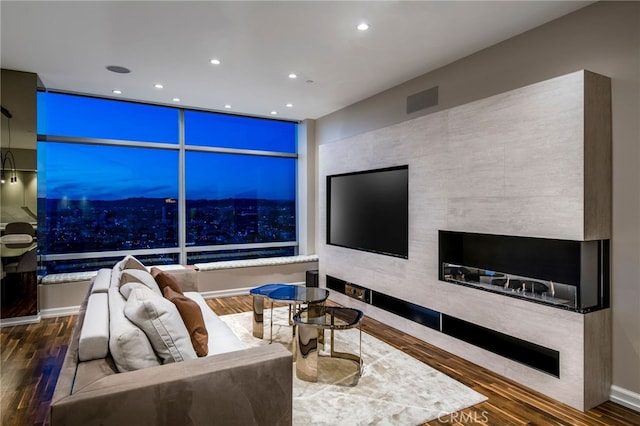 living room featuring dark wood-type flooring