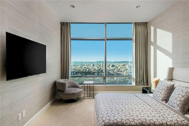 bedroom featuring carpet flooring and multiple windows