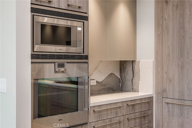 kitchen with decorative backsplash and stainless steel appliances