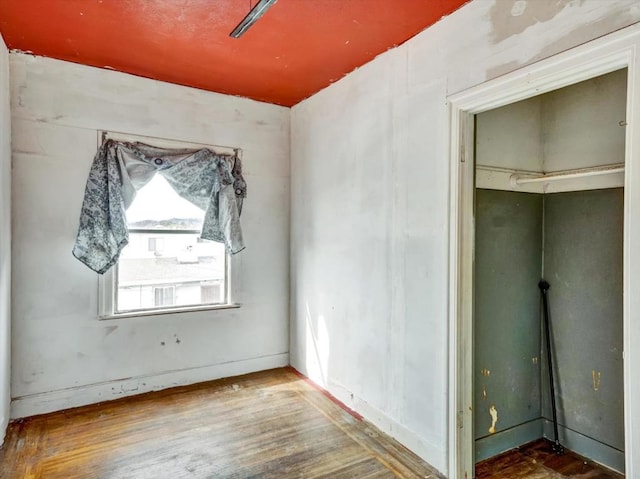 empty room with hardwood / wood-style floors