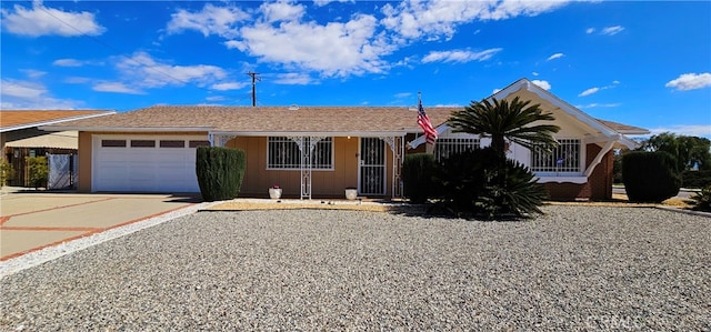 ranch-style home featuring a garage