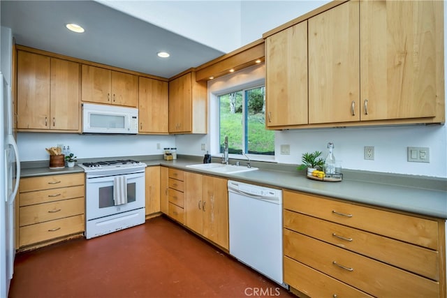 kitchen featuring white appliances and sink