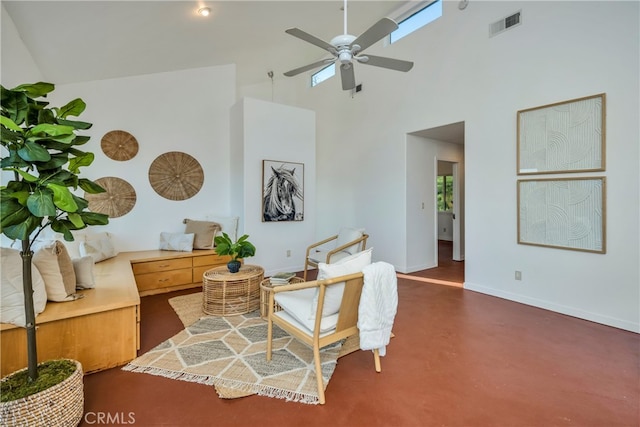 living area with high vaulted ceiling and ceiling fan