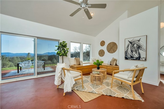 sitting room featuring a mountain view, high vaulted ceiling, and ceiling fan