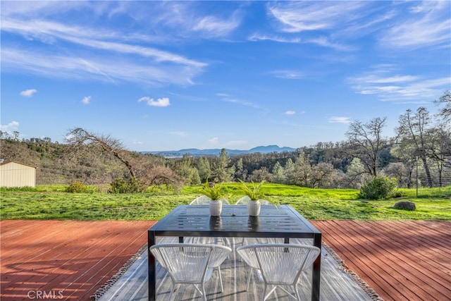 wooden deck with a mountain view